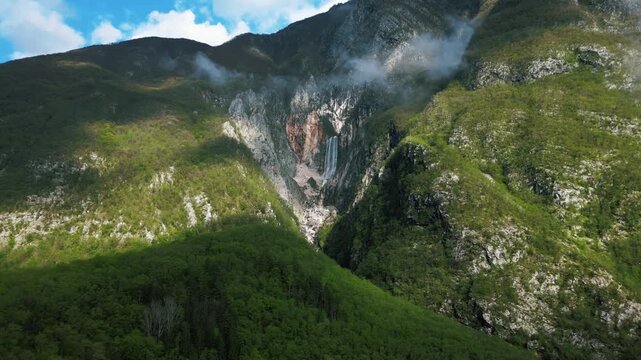 Drone flying towards the stunning Boka waterfall near Bovec, Slovenia, 4k