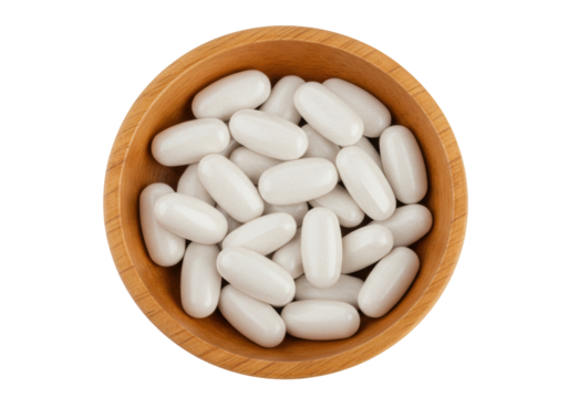 Isolated wood bowl of white capsules, health supplements, medicine, multivitamins, food additives