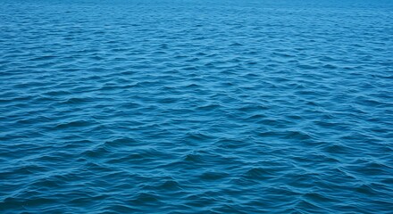 Obraz premium Calm ocean water surface with subtle ripples and shades of blue
