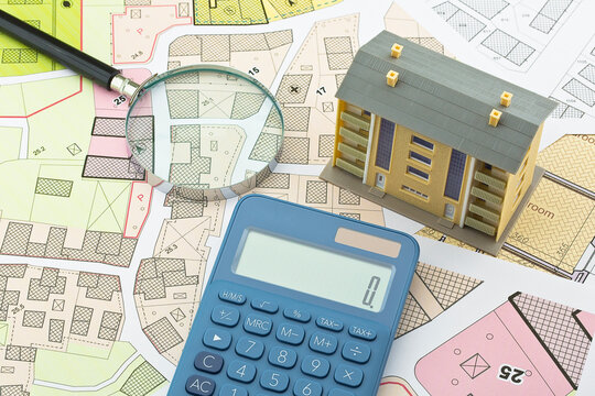 Imaginary cadastral map and general urban plan with cadastral parcels, urban destinations, vacant land plots and condominium residential building