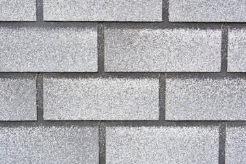 Detailed View of Weathered Gray Roof Shingles Texture