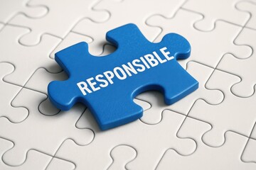 Fototapeta premium Vibrant blue puzzle piece marked RESPONSIBLE rests centrally on a pristine white jigsaw, symbolizing essential corporate governance and ethical business leadership for sustainable success