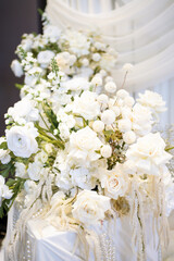The wedding background is decorated with white and blue flowers