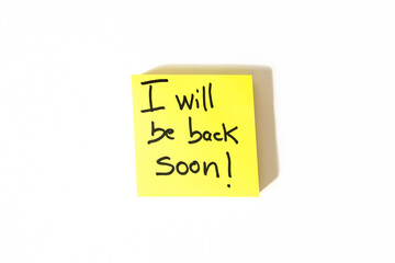 Yellow Sticky Note with &ldquo;I Will Be Back Soon&rdquo; Message