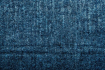 Close Up View of Woven Blue Fabric Texture Showing Detailed Pattern and Rough Surface with Highlight and Shadow