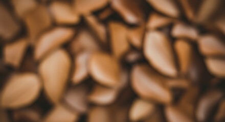 Close up of numerous almond halves creating a natural brown background