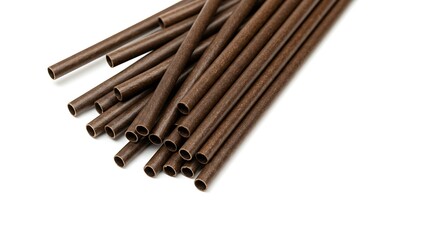 Close up of numerous brown tubes against a white backdrop isolated
