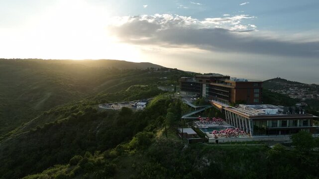 Sighnaghi, Georgia - July 15 2025: Aerial view of modern hilltop hotel Bodbe. Complex with Pool Terrace Overlooking Lush Green Valleys and Distant Horizon over Sighnaghi city