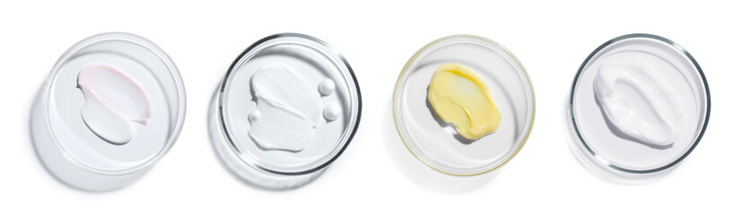 Petri dishes with cosmetic products on white background, top view