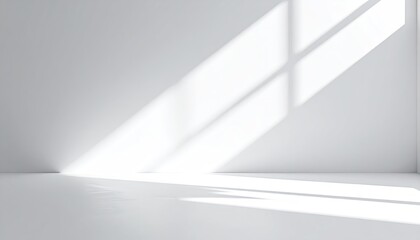 Minimalist white room interior with natural sunlight casting dramatic diagonal shadows and reflections across the floor and walls