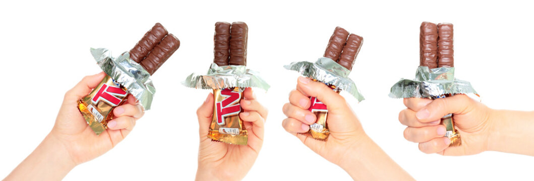 Set of Hand holding Twix open package, isolated on transparent background
