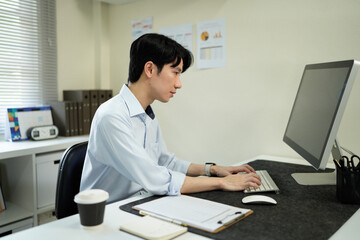 Fototapeta premium Business man, thinking and computer at desk in office for online research, reading email or report. Male entrepreneur person with internet connection for feedback, review and focus on project