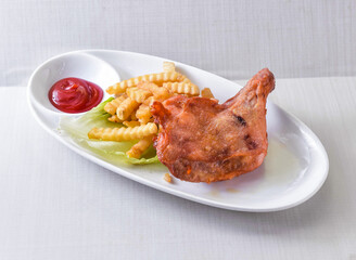 Delicious fried chicken meal with golden fries and ketchup. Perfect for showcasing comfort food, fast food options, or restaurant specials. Tempting, savory, and ready to eat!