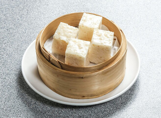 Savor the taste of authentic Chinese steamed oatmeal cake. Enjoy this culinary delicacy, perfect for restaurant menus, food blogs, or showcasing Asian culture. A delicious and visually appealing treat
