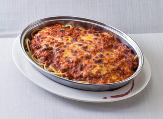 Savor the warmth of baked spaghetti, a hearty dish layered with rich meat sauce and gooey melted cheese. A comforting meal perfect for sharing with family and friends anytime.