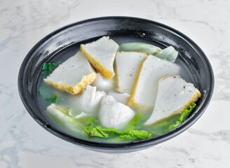 comforting bowl of Asian fish cake soup and fish balls greens and flavorful broth create a light, healthy meal, perfect for a quick lunch or warming dinner. Enjoy the taste of homemade goodness!