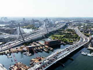 Fototapeta premium Aerial view of Boston city, bridges and river with skyline in sunlight. g.