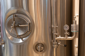 Technological equipment in modern beer plant close up