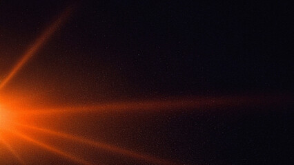Cinematic orange light rays and lens flare with film grain texture on dark background. Ideal for overlays, retro designs, video effects, and dramatic graphic art.