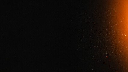 Dark abstract background with warm orange light and glowing dust particles, atmospheric film grain texture. Ideal for cinematic effects, overlays, and moody designs.