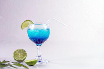 Blue Hawaiian Drink with lime, Blue hawaii cocktail on white  background