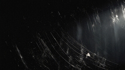 Dark grunge texture background with heavy scratches, dust, and film grain effect. Ideal for vintage photography overlays, cinematic video effects, retro designs, and abstract backdrops.