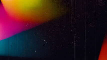 Vibrant abstract film grain background with colorful light leaks, dust, and scratches. A retro overlay texture perfect for digital design, photography effects, and cinematic branding.