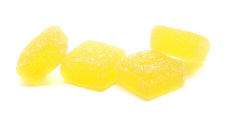 Yellow jelly sugar candies isolated on white background, side view	
