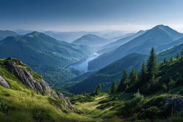 Fototapeta premium Panoramic View of Green Mountain Landscape with Lake Under Blue Sky Sunlight and Fog