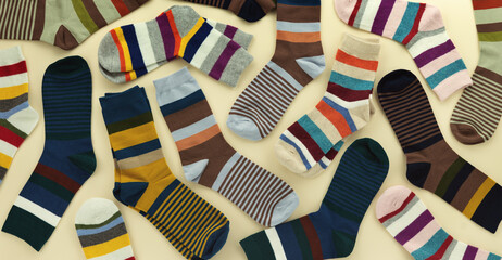 A panorama of men's socks on a beige background. Many different types of socks for men.