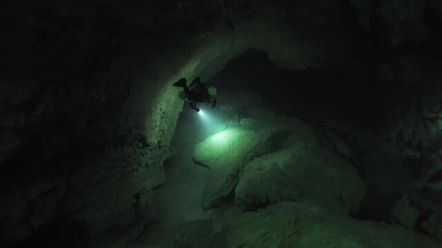 A haunting underwater experience of exploring Angelita Cenote caves in Tulum, M&eacute;xico.