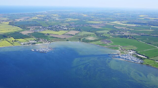 Aerial image of coastline and farm land in rural Denmark.