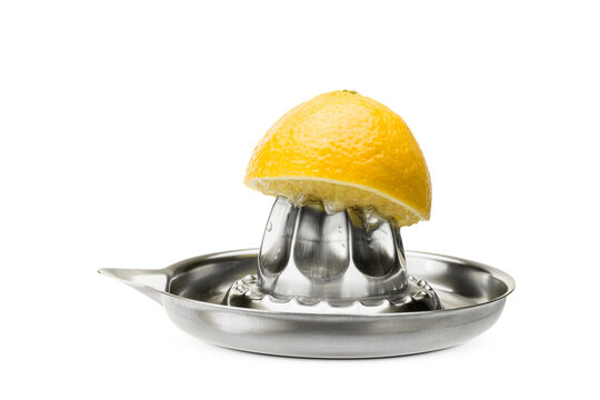 Stainless steel citrus juicer with squeezed fresh lemons, isolated on white background.