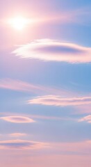 Obraz premium Beautiful pastel sky with soft clouds and sun, creating a serene and dreamy atmosphere, perfect for background or wallpaper