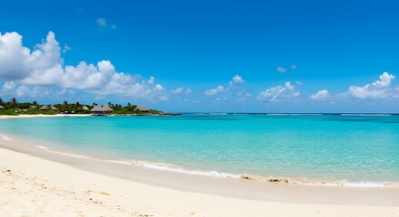 Idyllic beach scene with clear turquoise water and blue sky