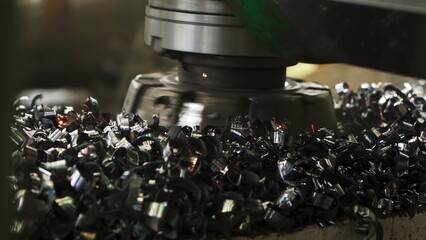 Industrial milling machine producing metal shavings and sparks. Stock clip