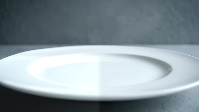 White empty plate on gray stone &mdash; clean food mockup background