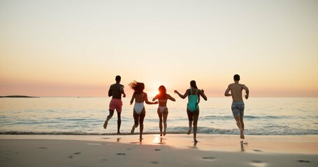 Back, people and run for fun on beach for summer vacation, tropical journey and travel weekend. Friends, playful and energy with ocean sunset, social gathering and holiday adventure for getaway trip