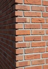 Fototapeta premium Brick wall corner with detailed texture for construction background