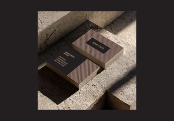 Stack of Editable Business Cards Mockup on Concrete Background.