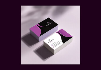Stack of Editable Business Cards Mockup on Purple Background.