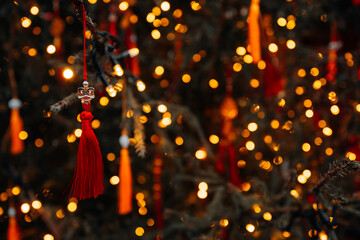 Close up traditional gold red decorations hanging outside on the Christmas tree, Chinese New Year and Asian holidays