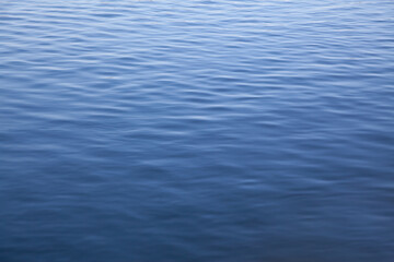 Calm ripples create a serene surface on the river during midday light