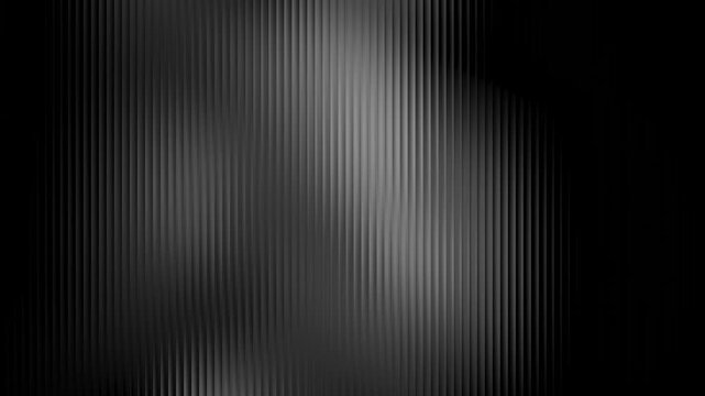 Dark ribbed abstract background with subtle light streaks and shadows creating a sophisticated