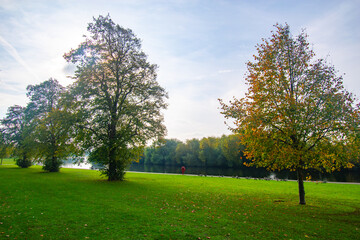 The river Trent with trees in autumn color and reflection on the water.