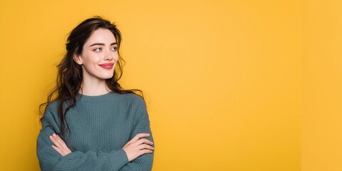 Obraz premium Model's head raised and looking forward,smiling,arms crossed,copy space,yellow background,banner