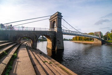 Fototapeta premium A view of Wilford Suspension bridge over the river Trent in Nottingham from the Victoria Embankment.