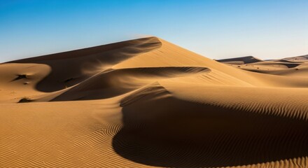 Golden sand dunes under a clear blue sky isolated on white background