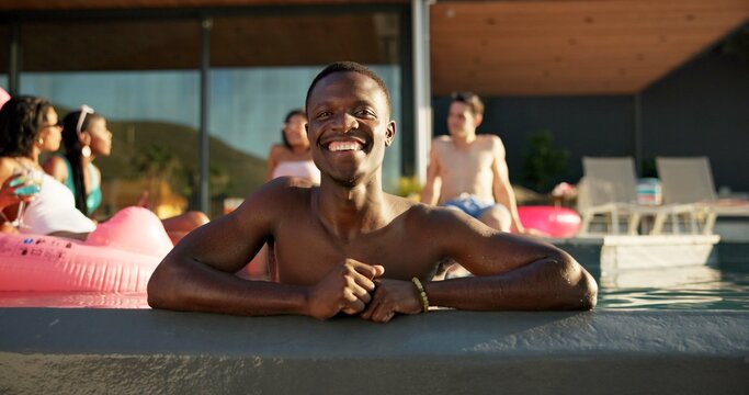 Happy, portrait and black man in pool at party at vacation house for break with friends for travel. Smile, relax and African person swim in water on holiday at lodge, resort or hotel in summer. - Powered by Adobe