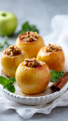 Baked apples with nuts and honey on a white plate